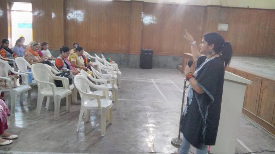 Dr. Renu Goyal presenting at a community wellness seminar